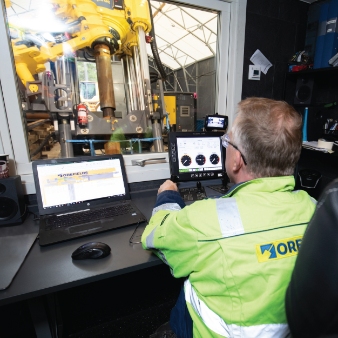 Photo of Orefields and Cementation office worker with laptop